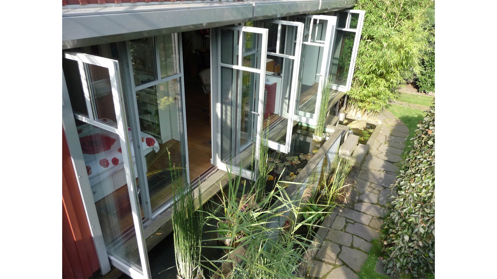 Wintergarten Gartenansicht Raumkontrast Kleine Oase